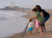 ADA Training Toddler, mom and child holding braces on the seashore
